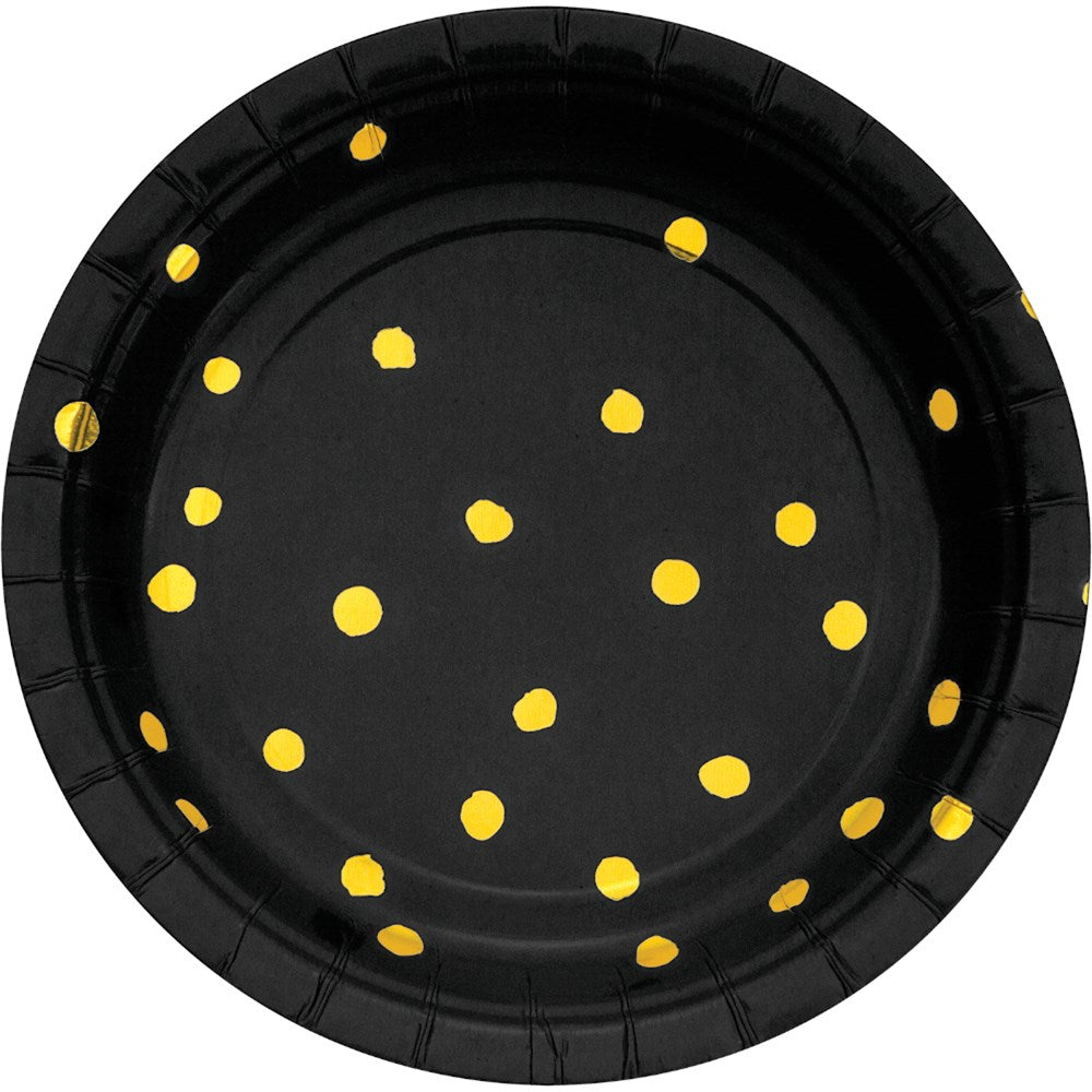 Black round paper plate with scattered gold foil polka dots and slightly raised edges.