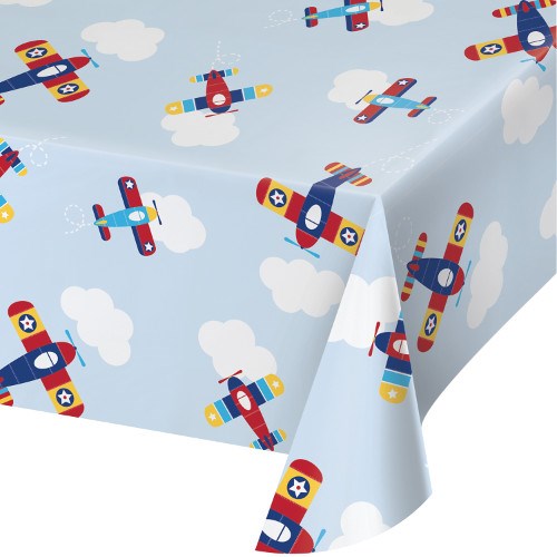Light blue plastic tablecover with colorful vintage-style airplanes and white clouds pattern.