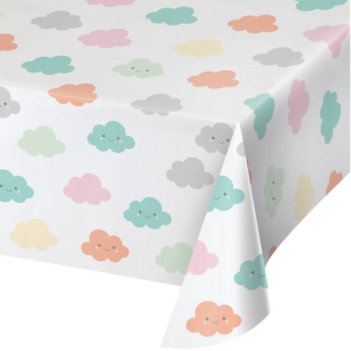 White rectangular tablecover with pastel clouds in yellow, orange, pink, gray, blue, and green smiling faces.