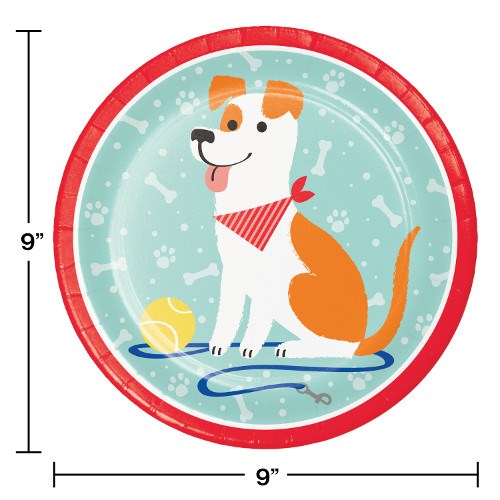 Round paper party plate with a red rim, featuring a brown and white dog wearing a red bandana, a yellow ball, and a blue.