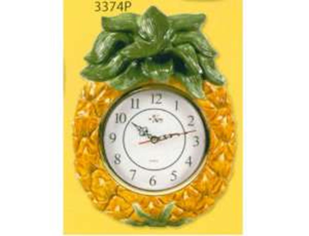 Wall clock shaped like a yellow pineapple with green leaves and black numbers on white face.