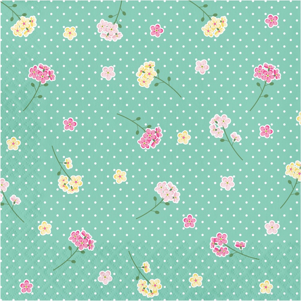 Green luncheon napkin with white polka dots and scattered small pink, yellow, and white floral prints.