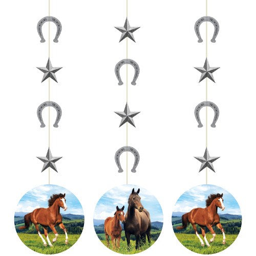 Hanging decorations with alternating silver horseshoes and stars above round cutouts of horses in green field under blue sky.