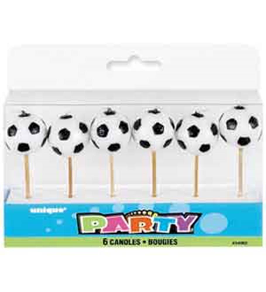 Set of six soccer ball shaped birthday candles on wooden sticks in clear plastic packaging.