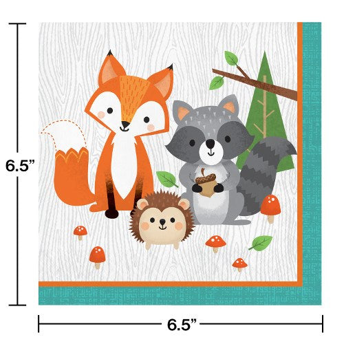 Square paper napkin with orange border featuring cartoon fox, raccoon with acorn, and hedgehog on a white wood-grain.