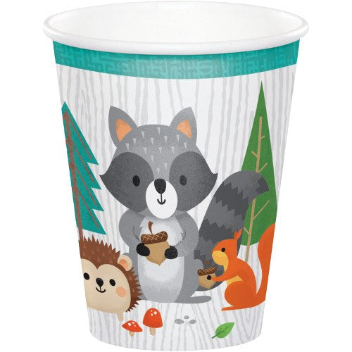 White 9oz cup with gray raccoon, orange squirrel, and beige hedgehog woodland animal illustrations, surrounded by green.