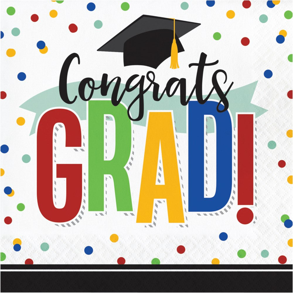 Square white luncheon napkin with multicolored confetti, "Congrats GRAD!" text in black and bold red, green, yellow, and.
