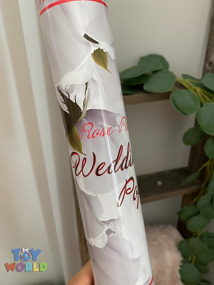 White cylindrical party popper with rose petal design and red text reading "Wedding Pop".