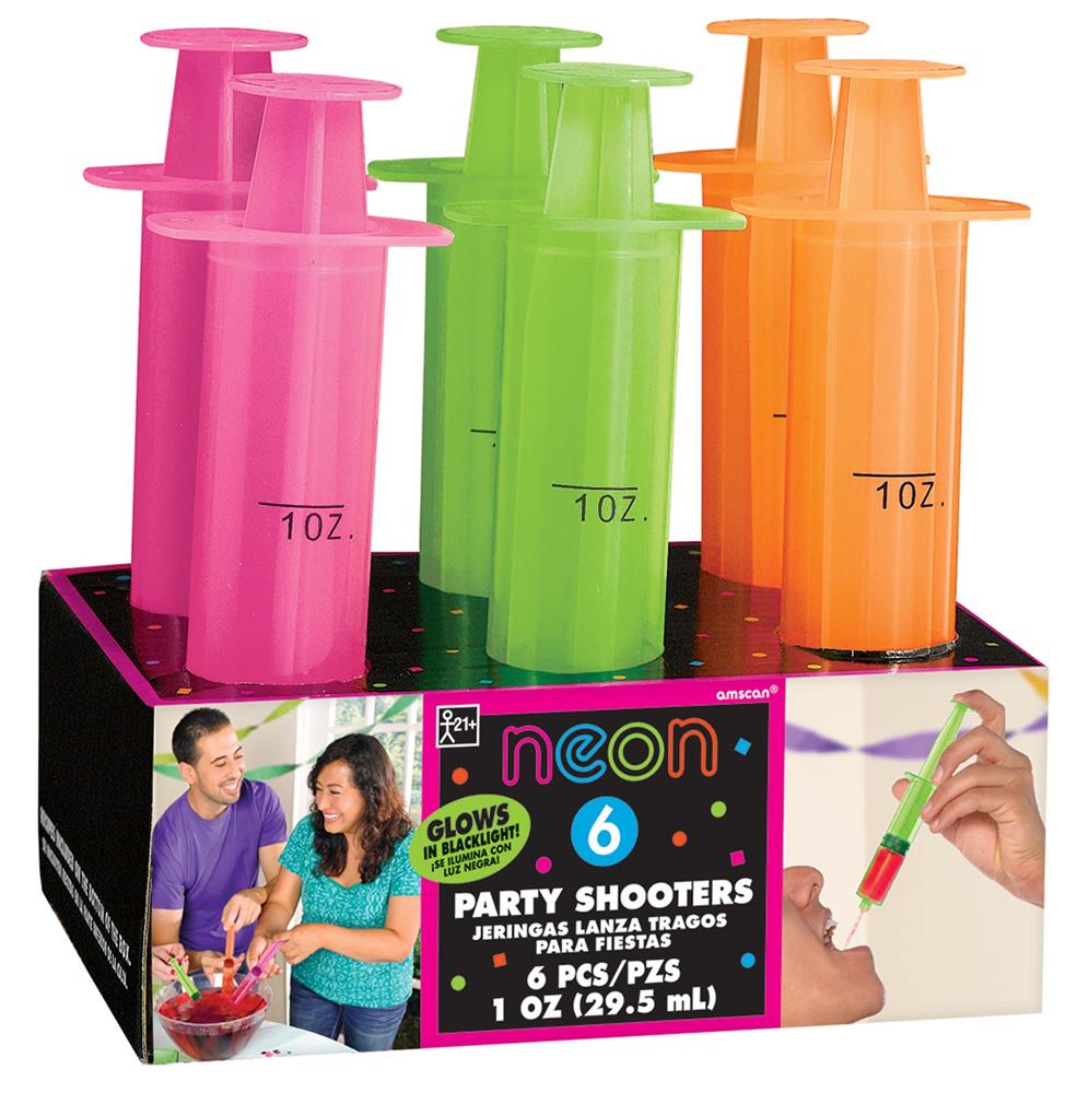 Set of six neon pink, green, and orange syringe shot glasses with 1 oz measurement marks in a black display box.