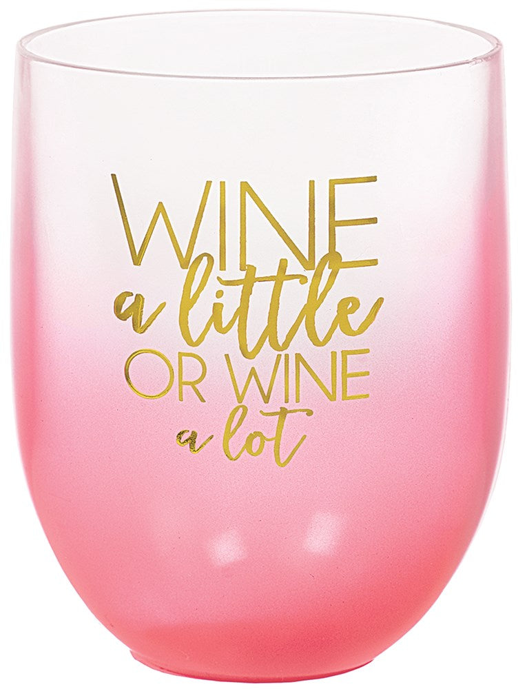 Pink ombre stemless wine glass with gold cursive text reading "Wine a little or wine a lot," 15 oz capacity.