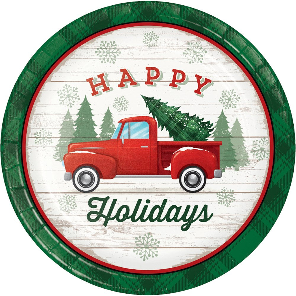 7-inch round paper plate with green rim, red vintage truck carrying Christmas tree, "Happy Holidays" text, and pine tree.