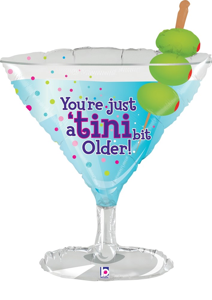 32-inch shiny foil balloon shaped like a martini glass with lime garnish and multicolored polka dots, blue text says "You're