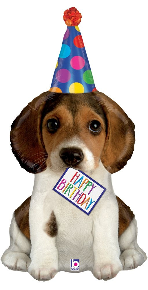 37-inch foil balloon shaped like a brown and white puppy wearing a colorful polka-dot party hat and holding a "Happy.