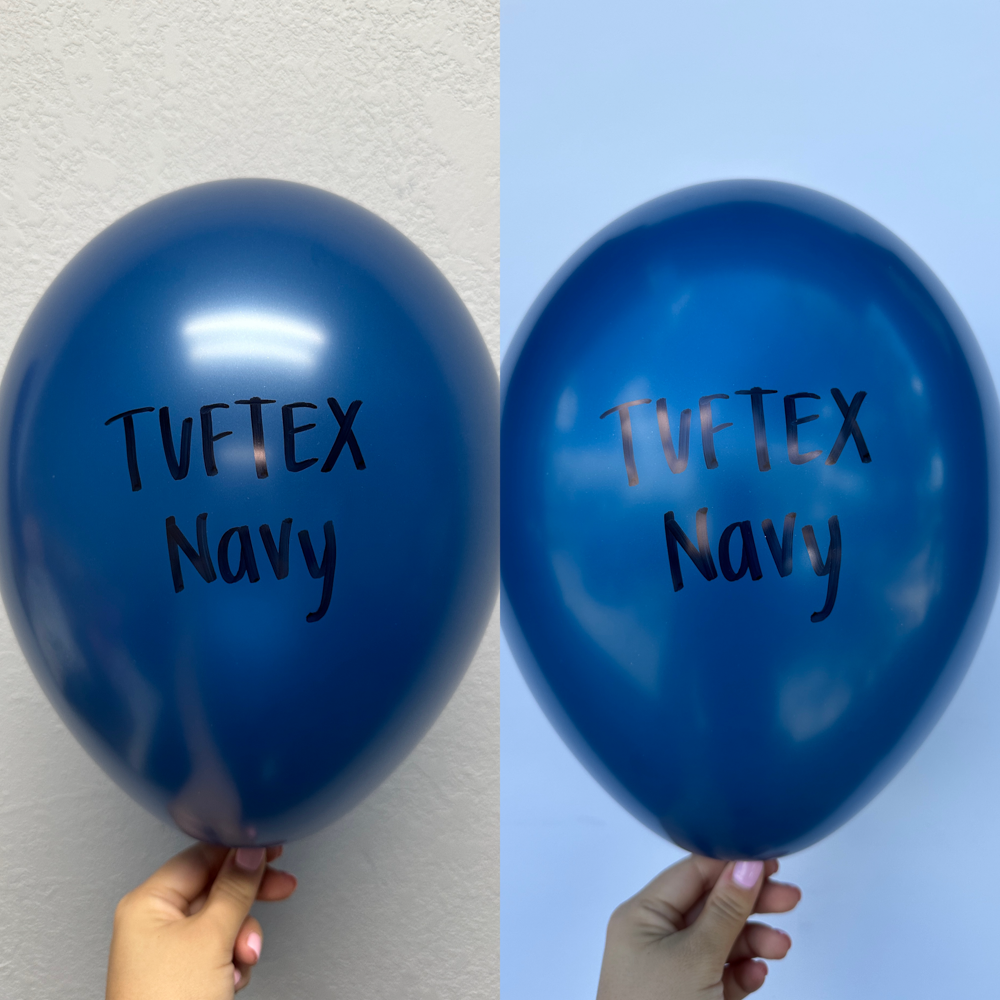 Navy blue latex balloon with TUFTEX Navy printed in black, held against a light background.