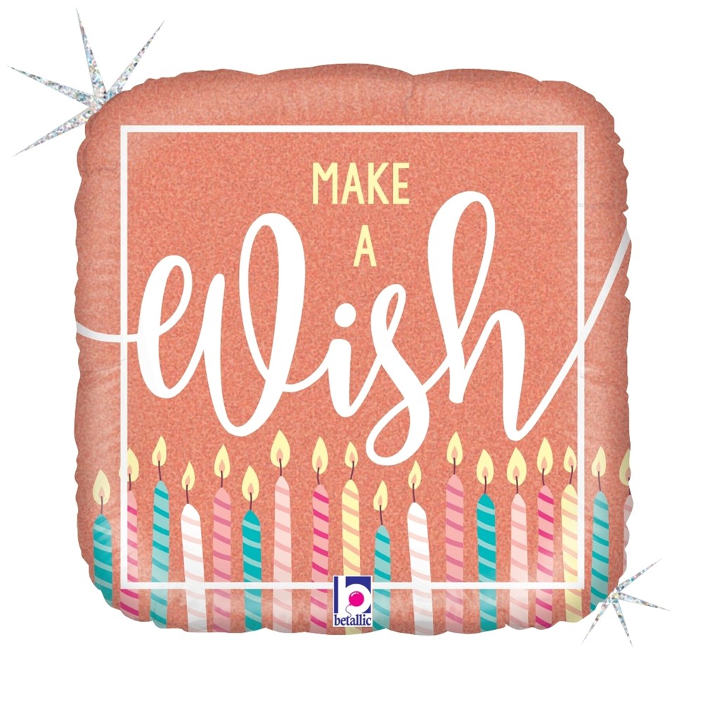 Rose gold square foil balloon with glitter finish, "Make a Wish" text, and colorful lit candles along bottom edge.