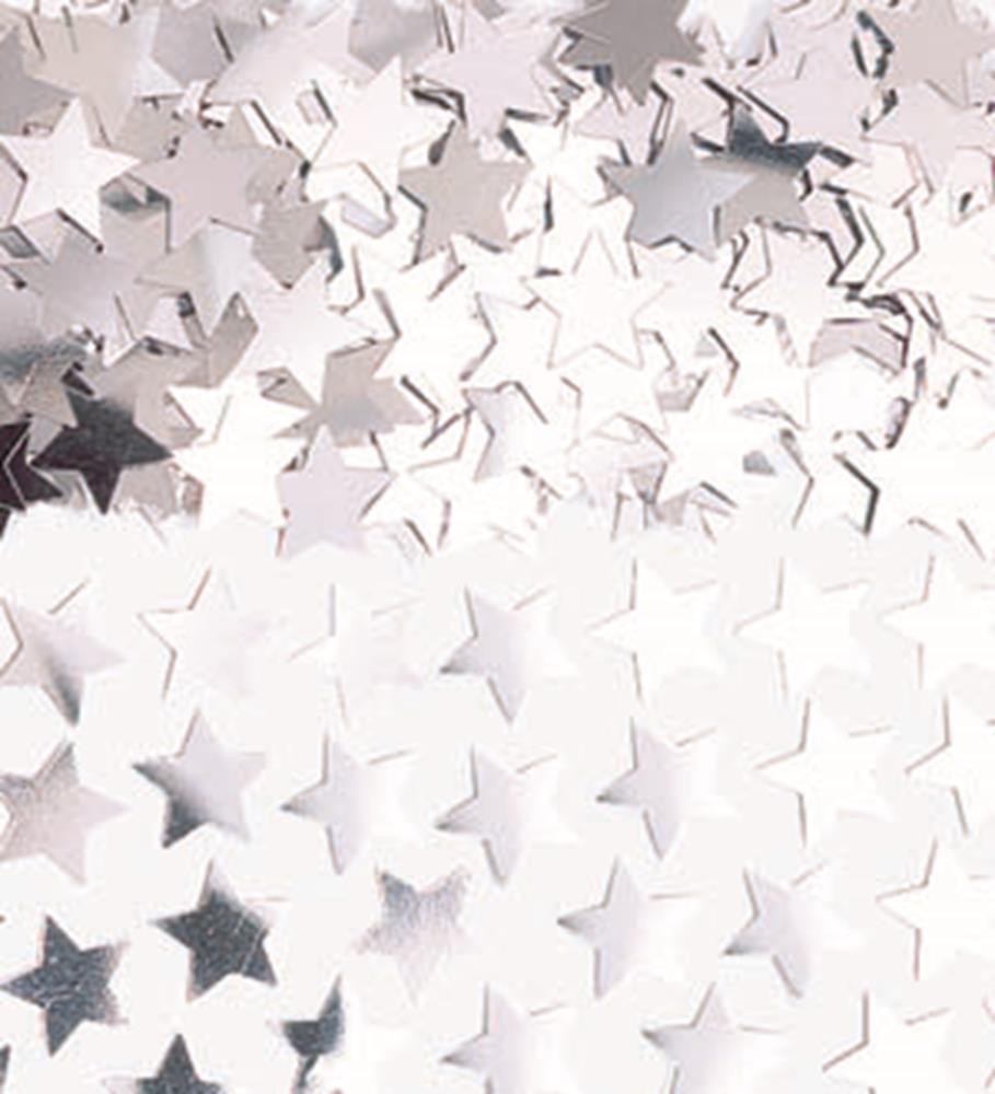 Shiny silver star-shaped confetti pieces densely scattered on a white surface.