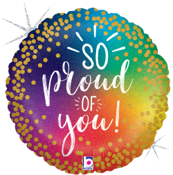 Round 18-inch holographic foil balloon with rainbow gradient, gold confetti dots, and "So Proud of You!" text in white.