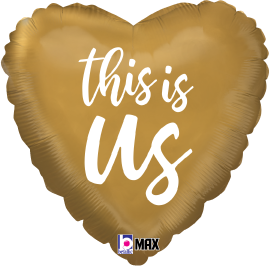 Gold heart-shaped foil balloon with white cursive text reading "this is Us".