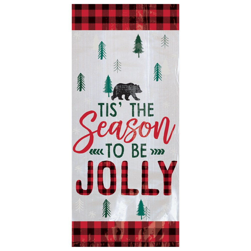 Clear cello party bag with red and black buffalo plaid borders, decorated with green pine trees, a black bear, and festive.