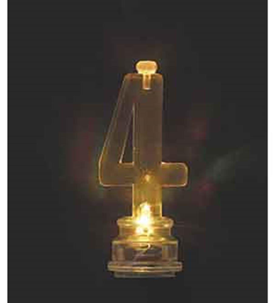 Transparent number 4 birthday candle with a glowing yellow LED light inside.