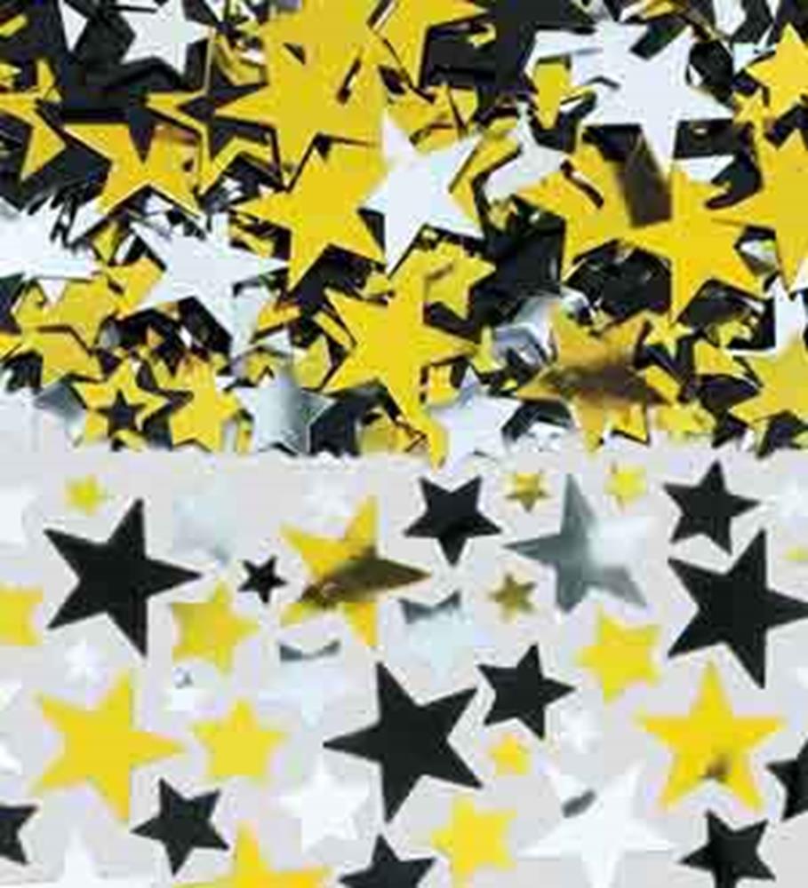 Assorted black, gold, and silver metallic star-shaped confetti pieces scattered on a white surface.