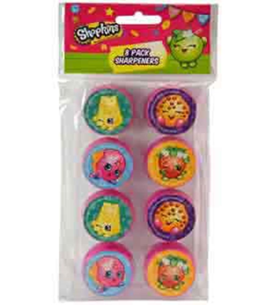 Set of eight round Shopkins pencil sharpeners with colorful character designs in pink, purple, orange, and blue backgrounds.