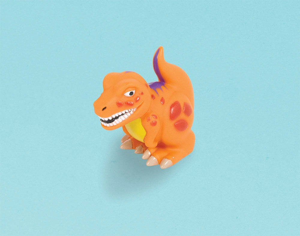 Small orange dinosaur squirt toy with purple spots and white teeth on a blue background.