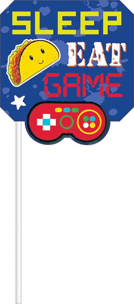Bright party photo prop with blue shield shape, yellow taco, red and white game controller, and text "SLEEP EAT GAME".