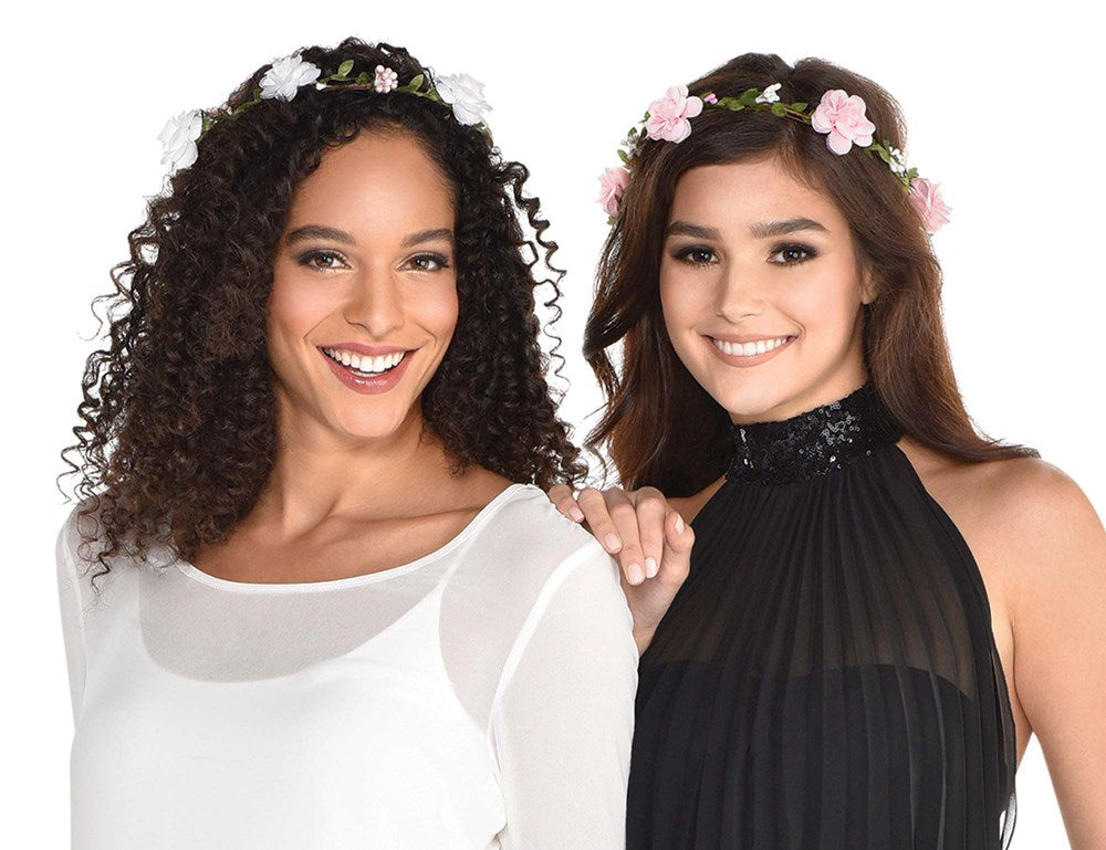 Set of six floral headwreaths featuring pink, white, and green flowers on flexible green stems worn by two women with curly.