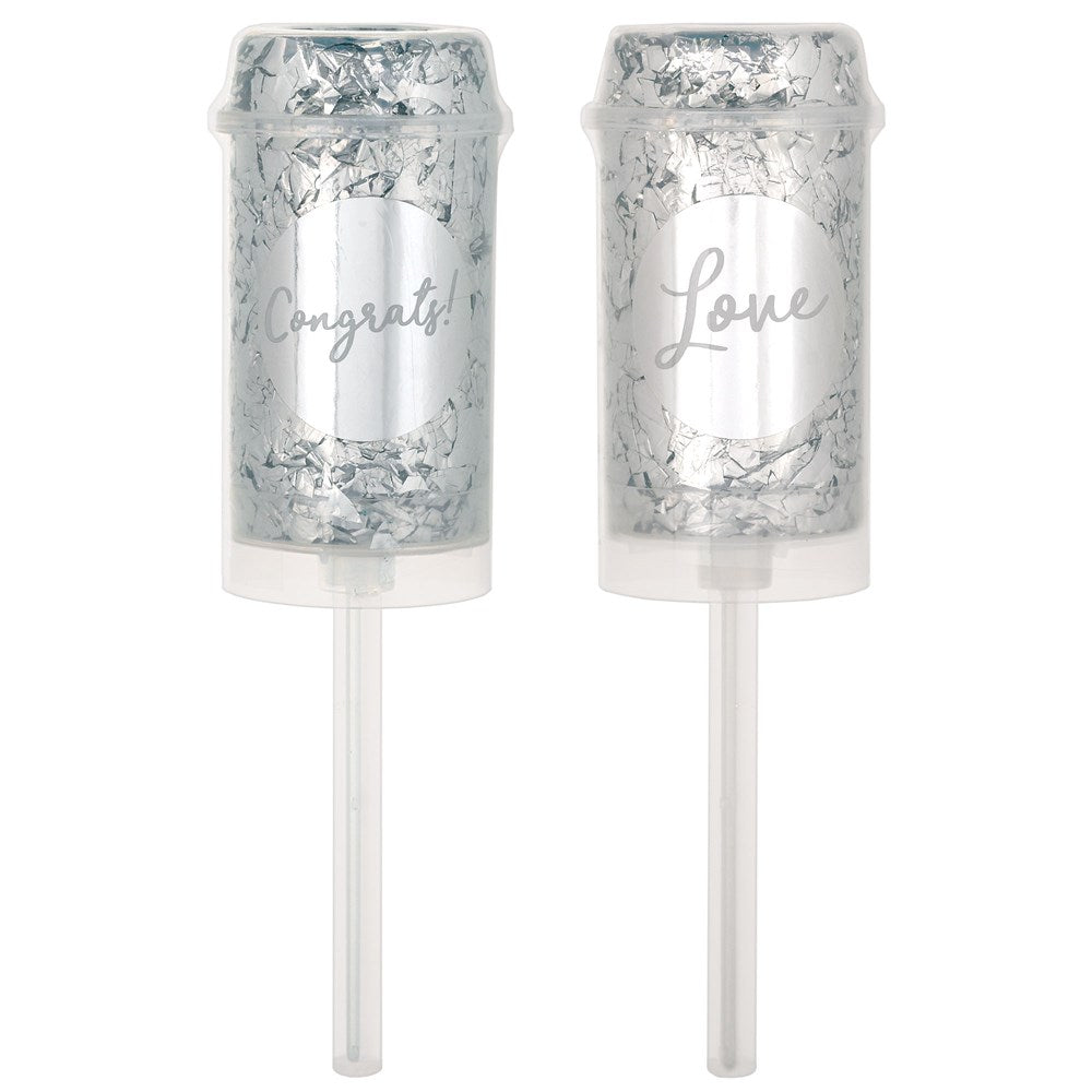 Two silver push-up confetti poppers with clear plastic handles, one labeled "Congrats!" and the other "Love" in elegant.
