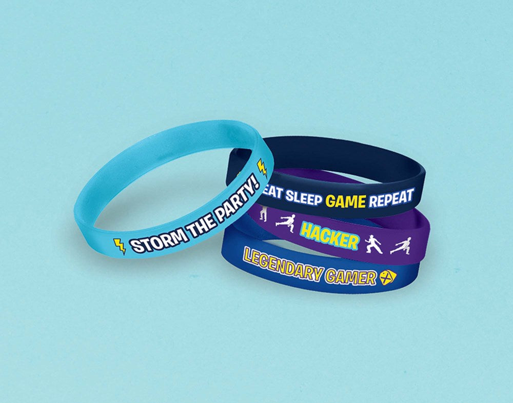 Set of four rubber bracelets in blue and purple with superhero-themed text and icons.