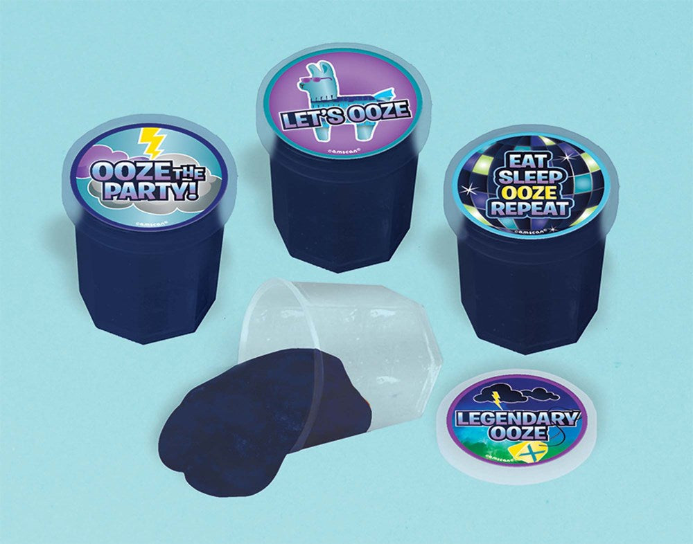 Set of four black putty containers with colorful superhero-themed lids and glossy black putty inside one opened container.