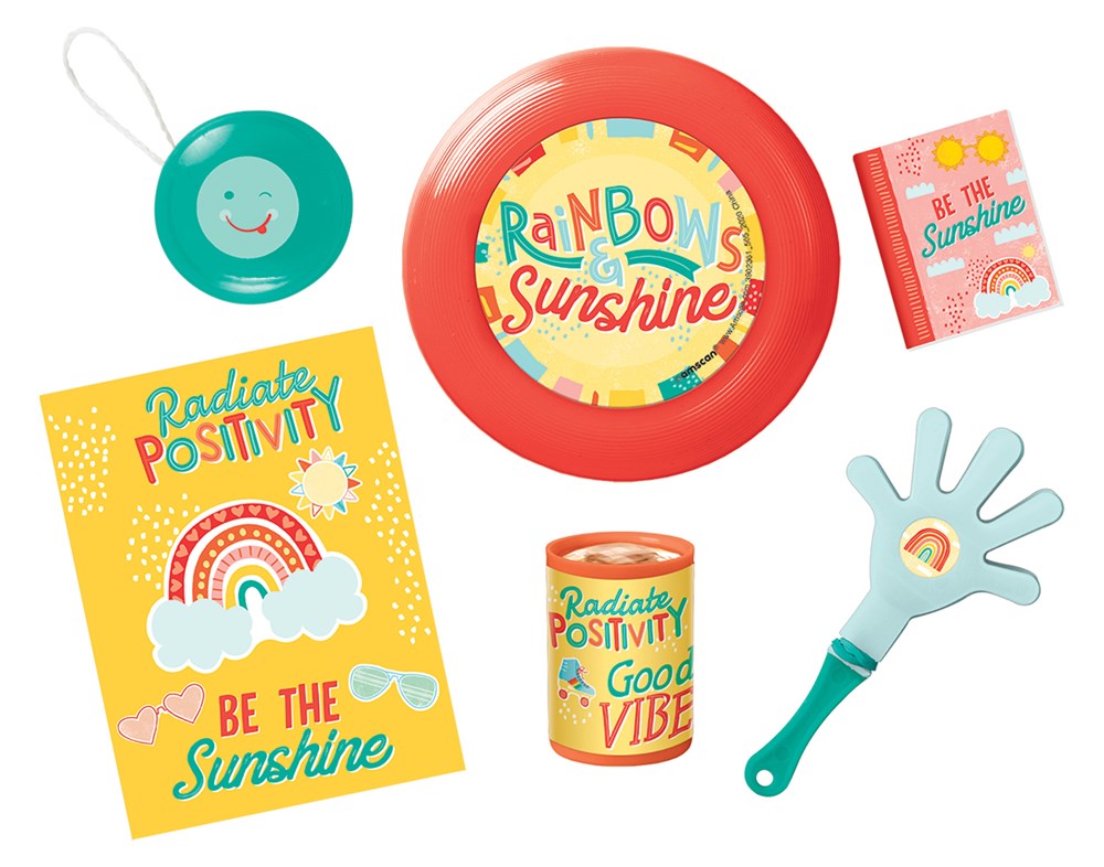 Colorful retro-themed party favor set including yellow positivity card, red "Rainbows & Sunshine" plate, smiley-face teal.