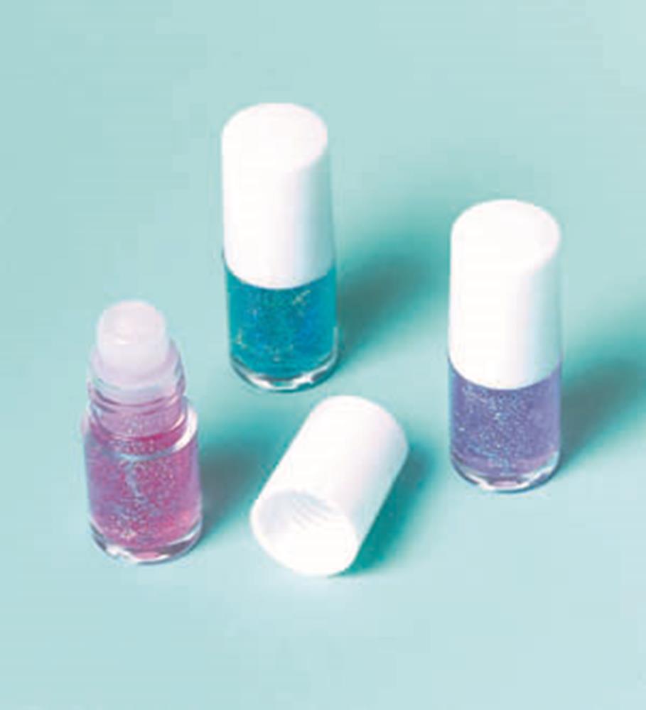 Three small clear bottles of glitter face paint in pink, blue, and purple with white caps on a light blue background, one.