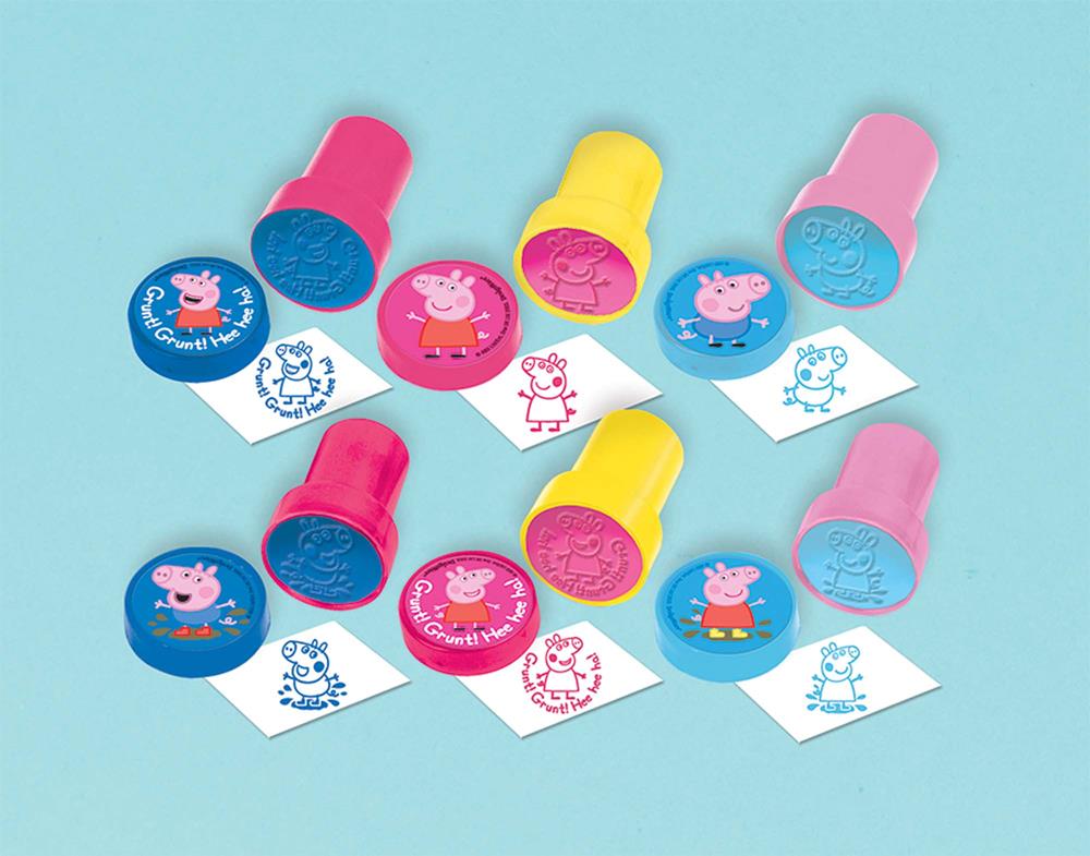 Six Peppa Pig themed stampers in pink, yellow, and blue with matching inked stamps showing Peppa and friends designs.