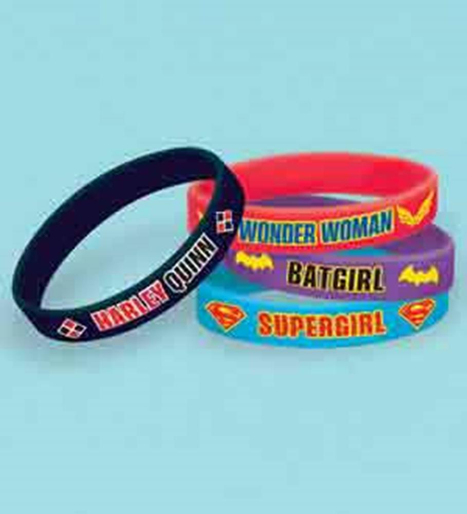 Set of six DC Super Hero Girls rubber bracelets featuring black, red, purple, and blue bands with character names and logos.