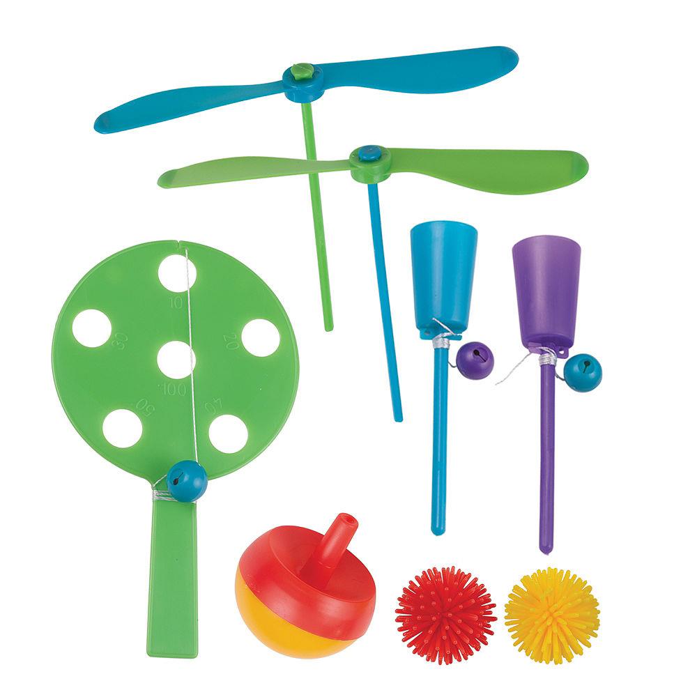 Colorful plastic propeller toys, paddle ball sets, spinning top, and spiky balls in red, yellow, green, blue, and purple.