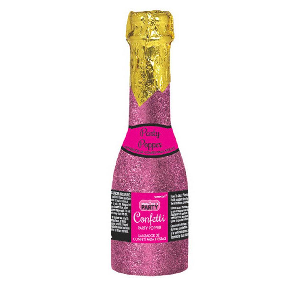 Pink glitter-covered party popper bottle with gold foil top and black label accents.