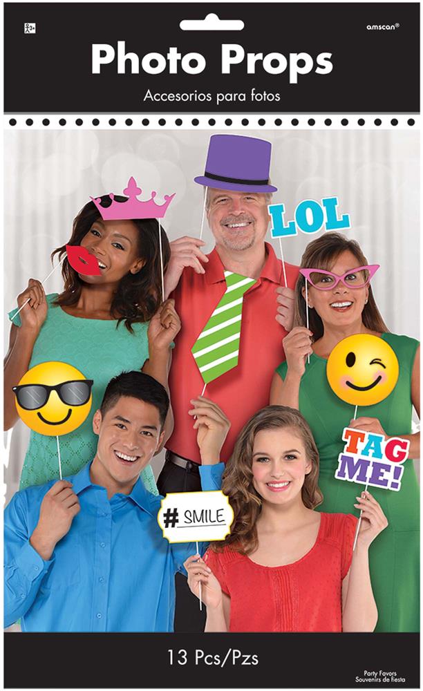 13 colorful photo booth props including speech bubbles, emoji faces, glasses, a crown, tie, and top hat on sticks.