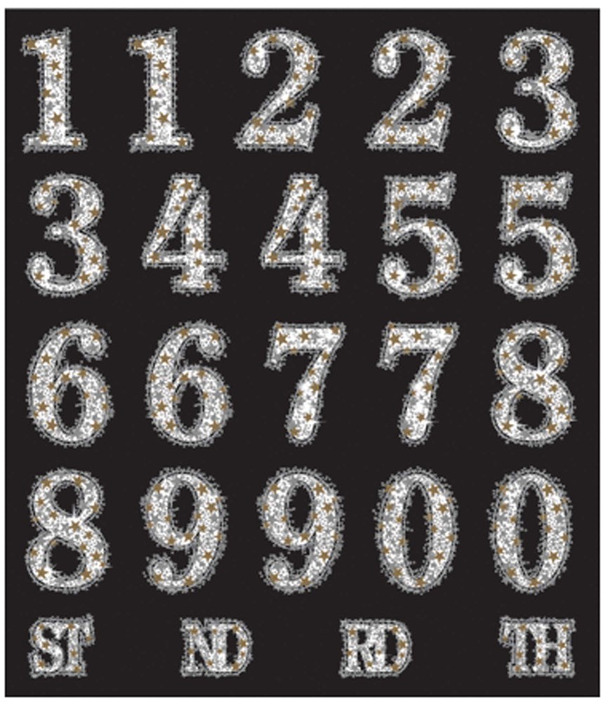 Black and gold glittery number and letter party toppers with rhinestone accents.