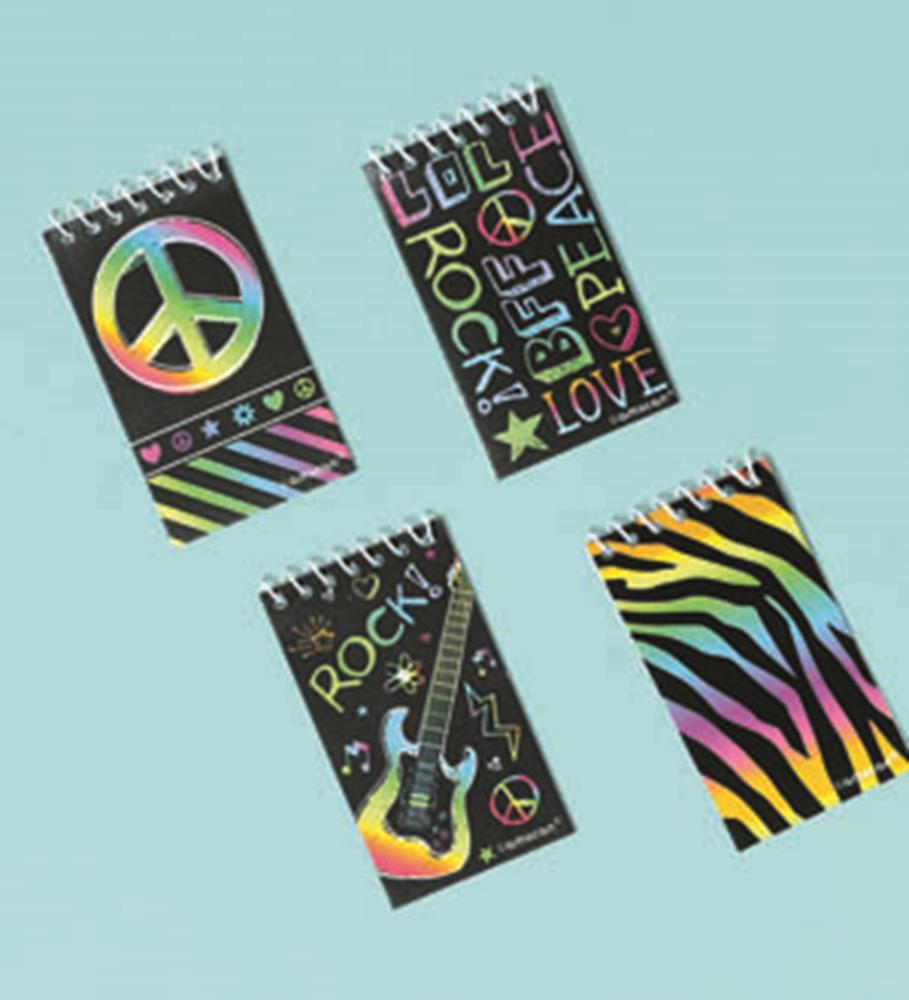 Four neon memo pads with spiral binding, featuring colorful peace signs, rainbow stripes, guitar, and zebra print designs on