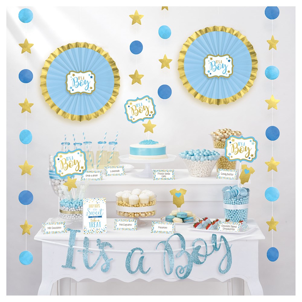 Blue and gold baby shower buffet kit with decorated paper plates, cupcake toppers, popcorn boxes, and "It's a Boy" banner.