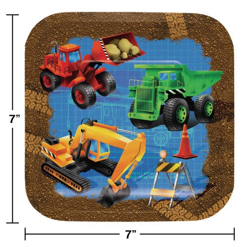 Square kids party plate with red bulldozer, green dump truck, yellow excavator, and construction barriers on dirt background.