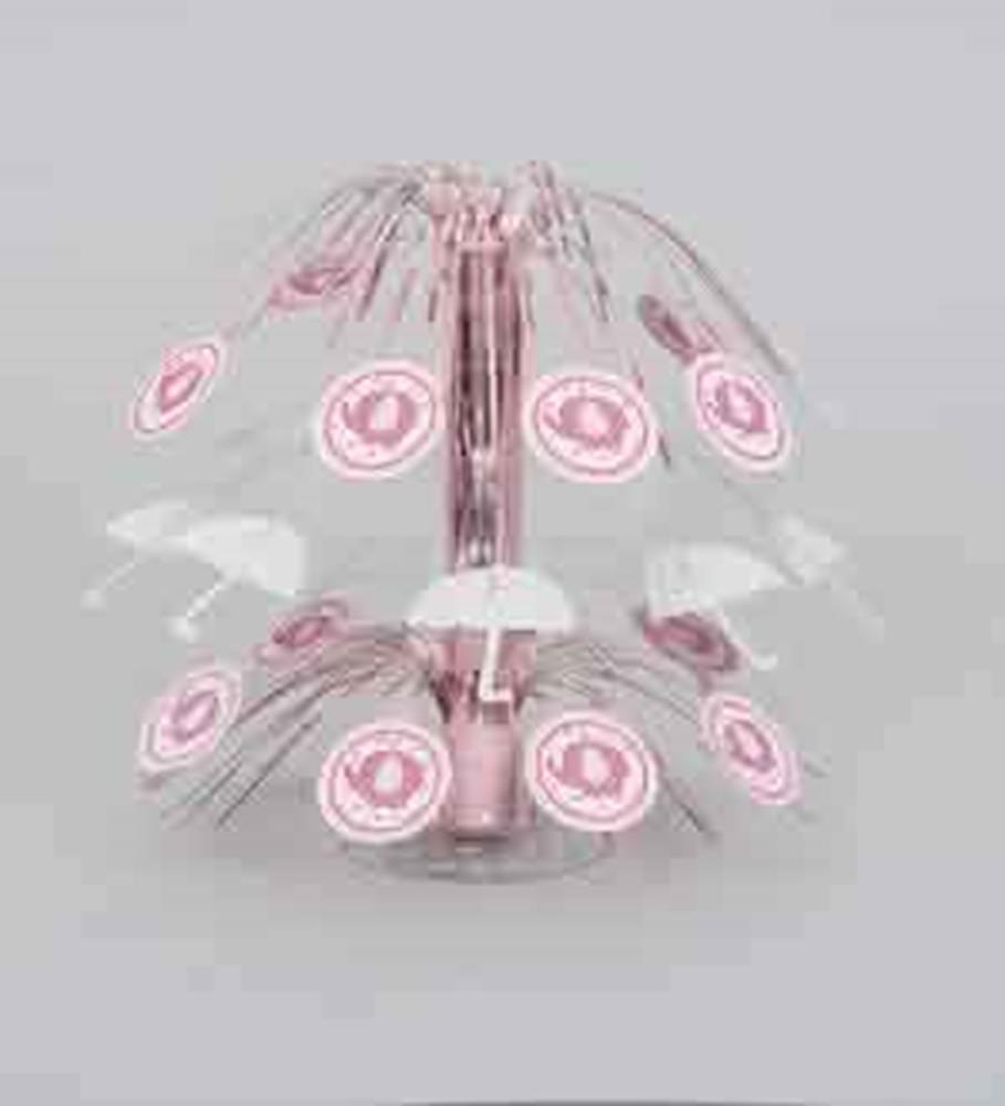 Pink metal carousel-themed baby shower centerpiece with hanging umbrella and elephant cutouts.