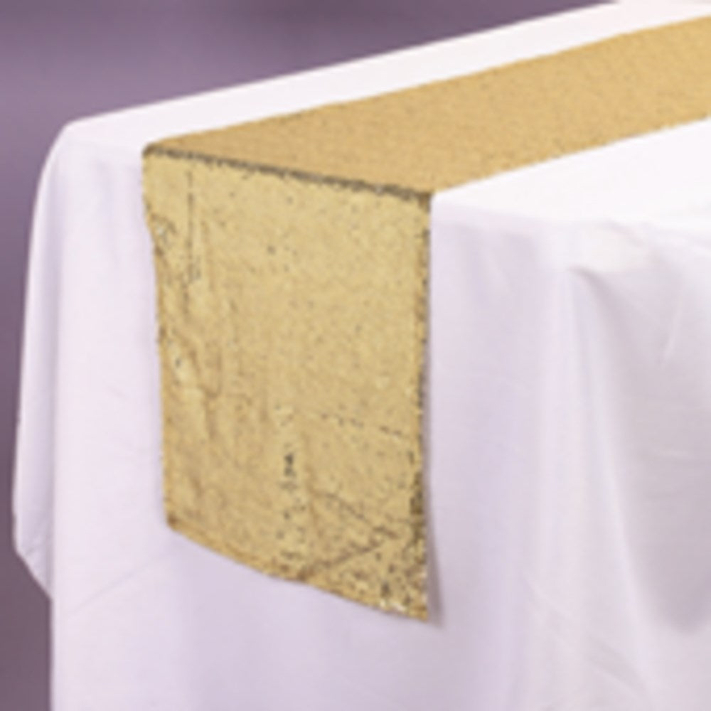Gold sequin fabric table runner, 14 by 108 inches, laid flat on white tablecloth.