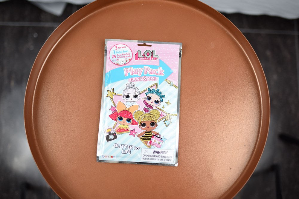 Small rectangular LOL Surprise Grab N Go Play Pack with colorful cartoon characters on pastel blue and pink packaging.