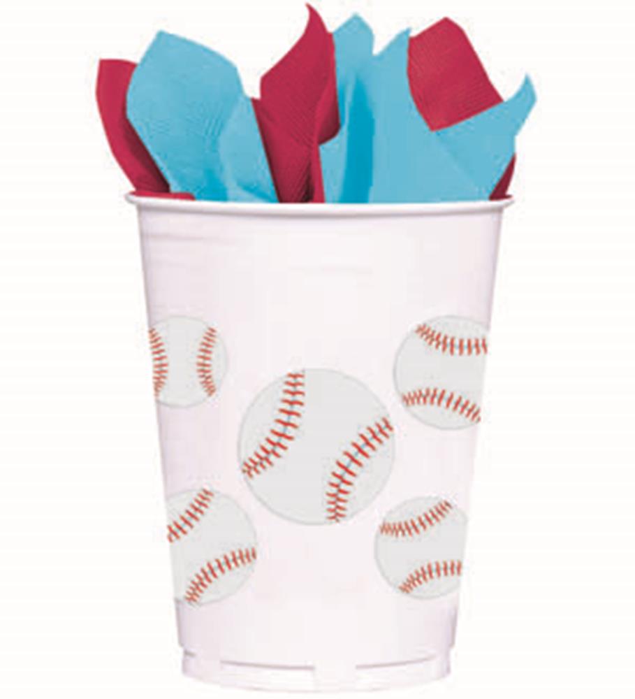 White plastic cup decorated with multiple baseball prints, filled with red and blue napkins.