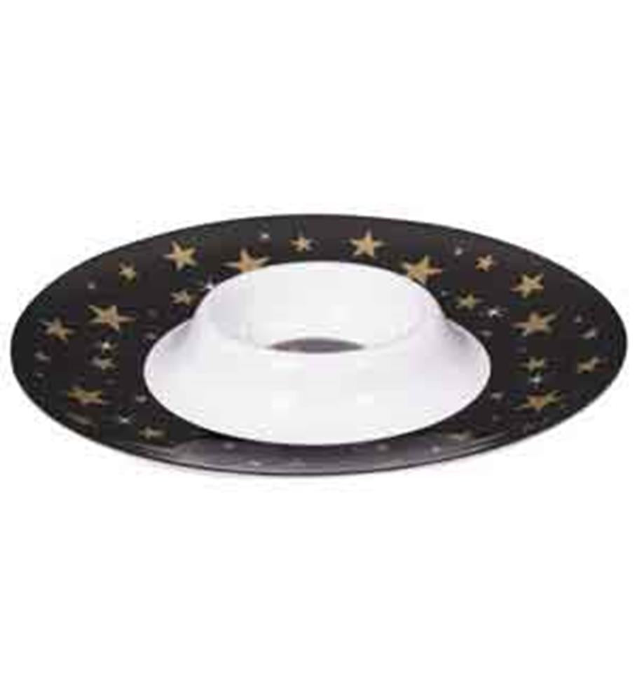 Round black chip and dip platter with gold star pattern and central white dip bowl.