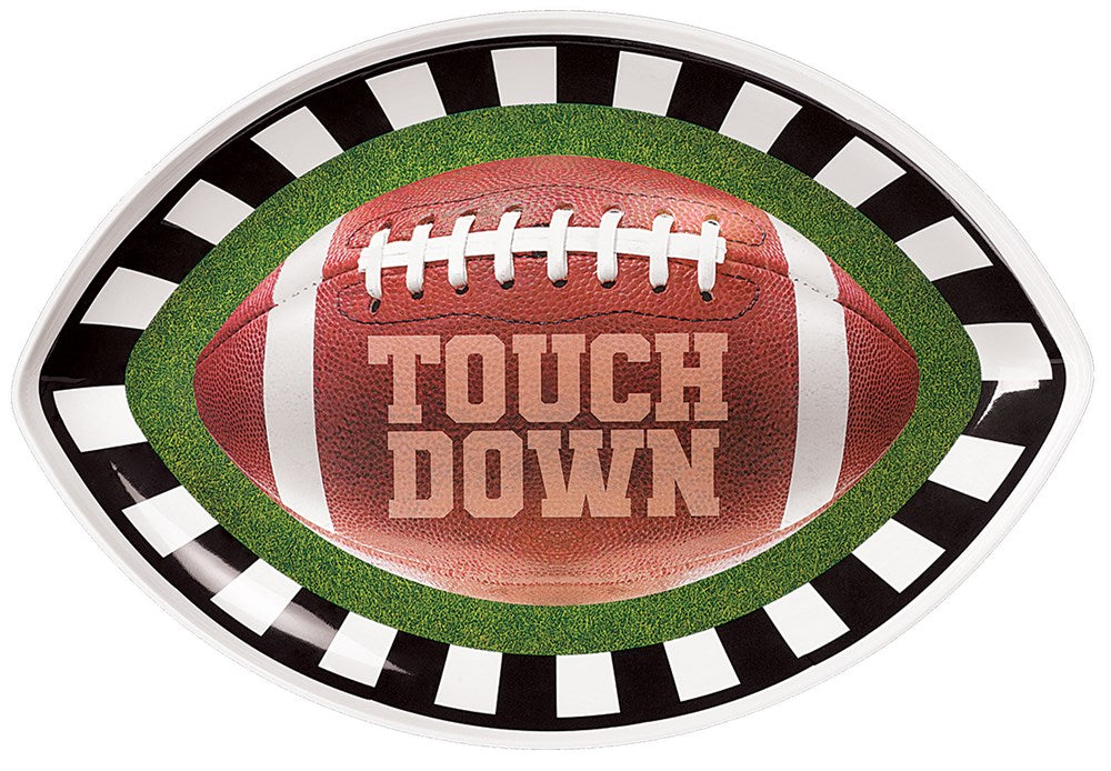 Football-shaped melamine platter with green grass border and black-and-white striped rim, featuring brown football design.