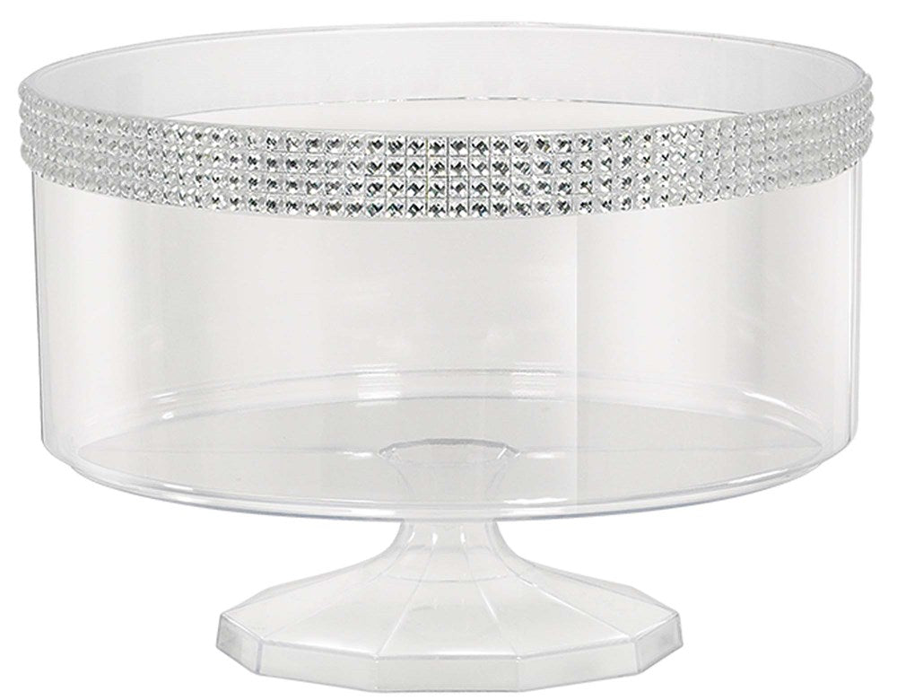 Clear small trifle container on pedestal with a band of silver gem embellishments around the rim.